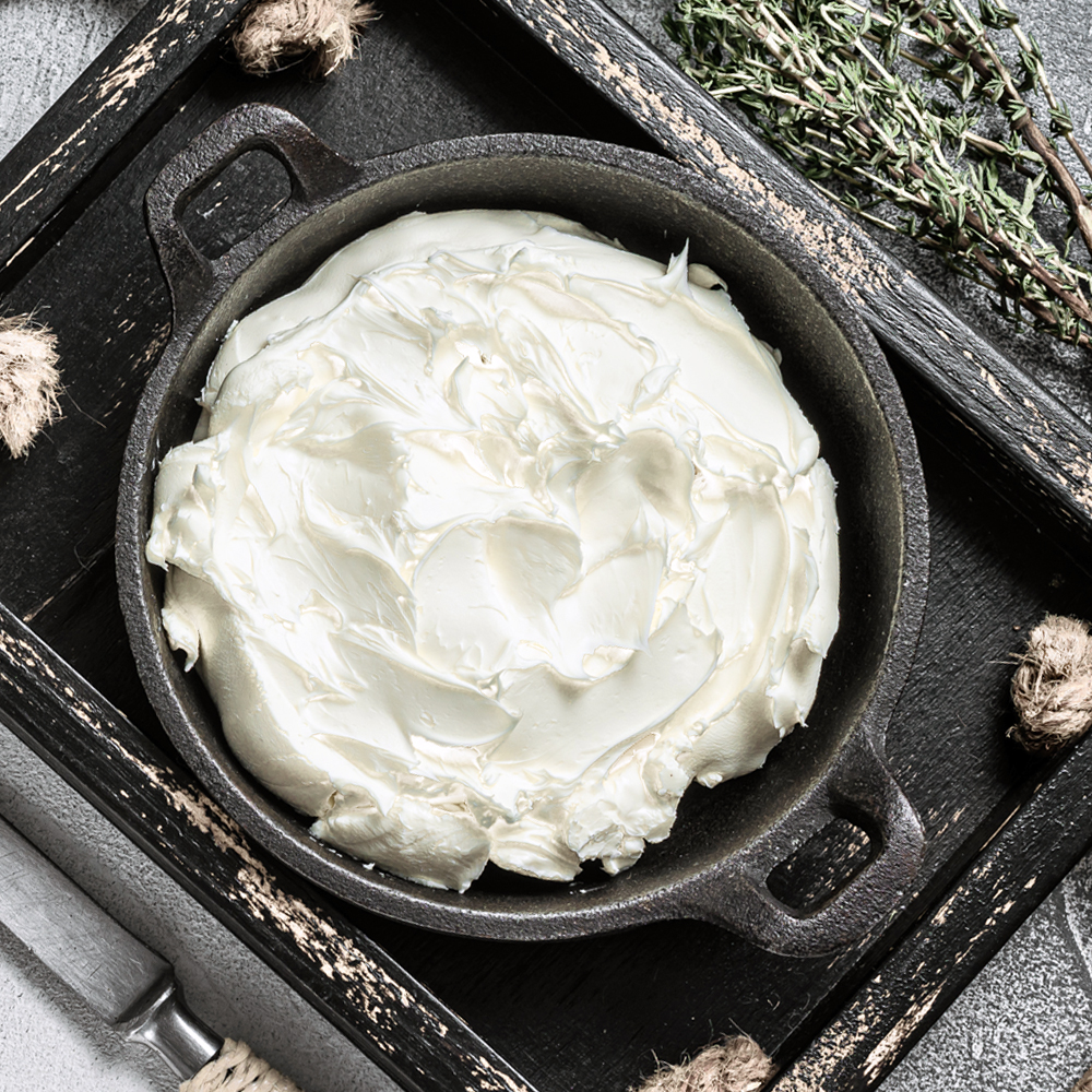 A selective focus shot of a delicious cheese platter on the table with walnuts on it